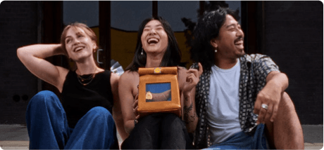 People posing with a product